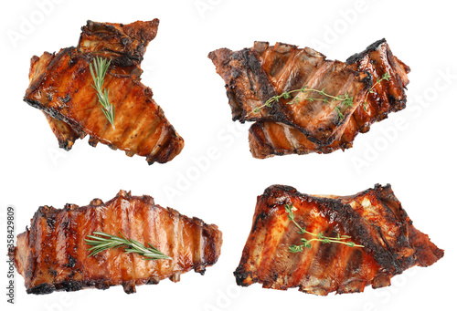 Set with delicious grilled meat on white background, top view