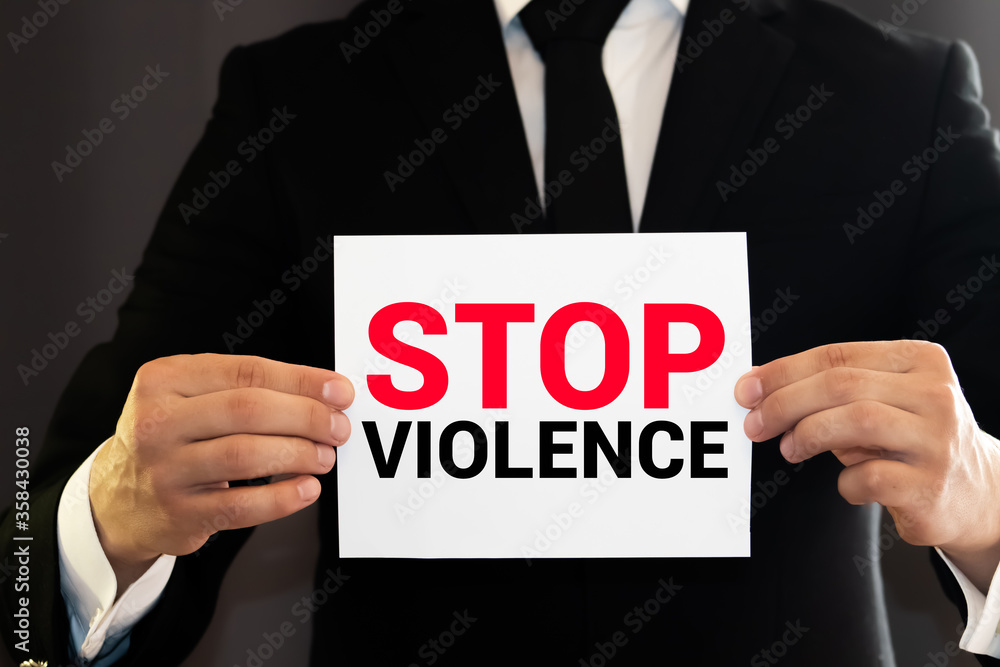 Stop Violence stencil print on the grunge brick wall Stop Violence stencil print on the grunge brick wall