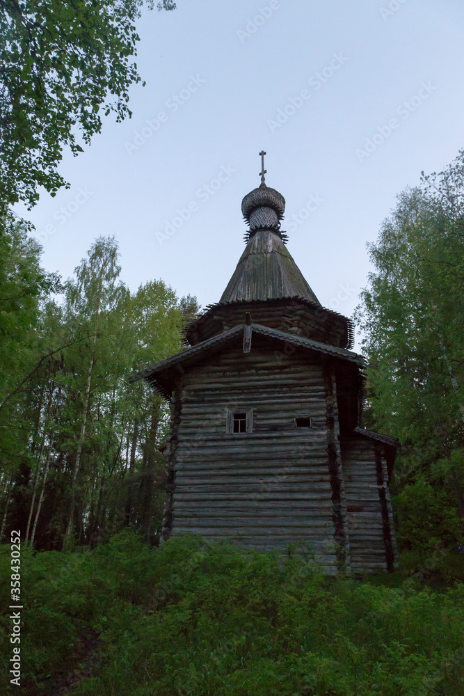 Russia, Karelia: White nights. Dawn on Lake Muezero. Trinity Monastery on Trinity Island, old wooden church of St. Nicholas.