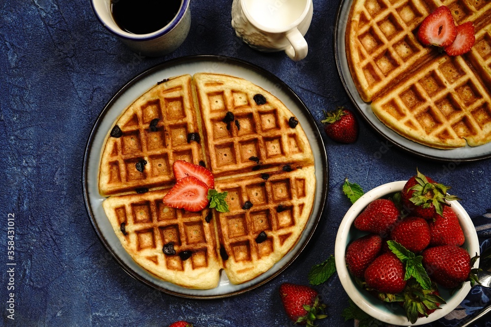 Homemade Chocolate chip waffles with strawberries Homemade Chocolate chip waffles with strawberries