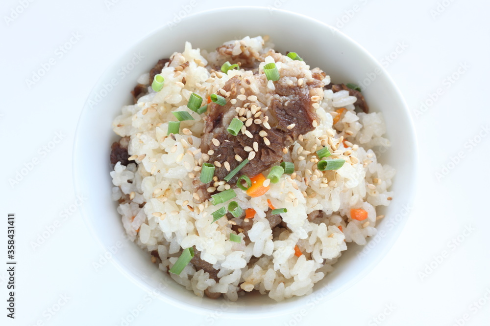 Japanese food, beff and carrot mixed rice with sesame and spring onion Japanese food, beff and carrot mixed rice with sesame and spring onion