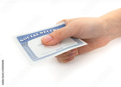 Hand holding social security on a white background.