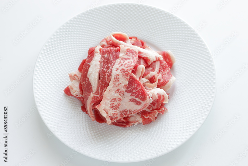 Freshness Japanese marble beef slices on white plate with copy space Freshness Japanese marble beef slices on white plate with copy space