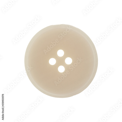 Beige plastic sewing button isolated on white