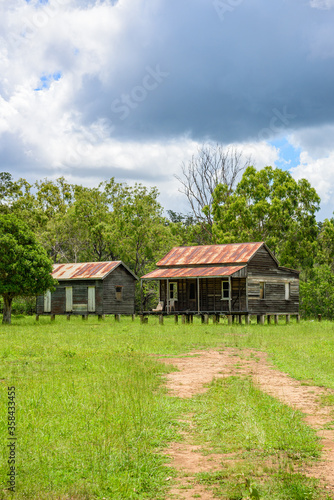 disused homestead in the middle of a green field in Kroombit Tops National Park, Queensland © Photopia Studio