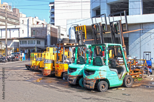 Forklift trucks lined up outside a fish market in Tokyo, Japan.