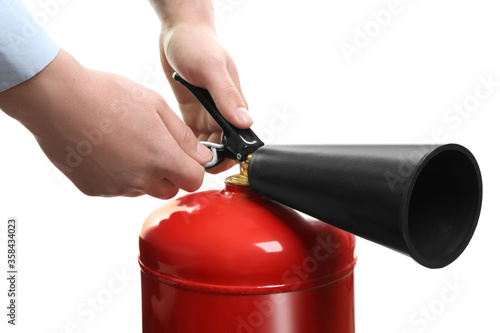 Man using fire extinguisher on white background, closeup photo