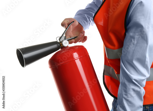 Worker using fire extinguisher on white background, closeup photo