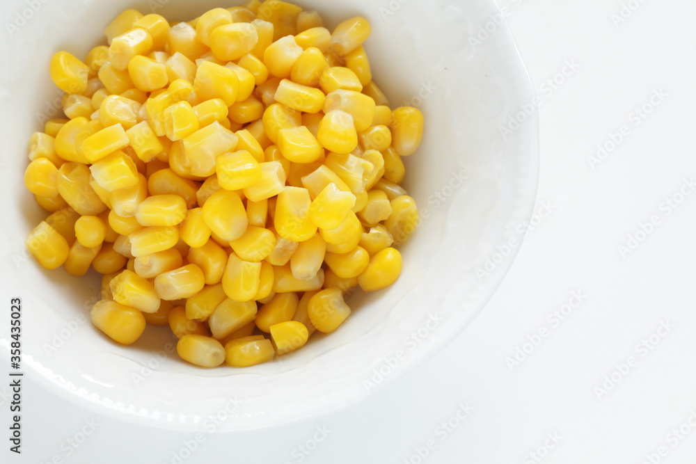 Prepared sweet corn on white background with copy space Prepared sweet corn on white background with copy space