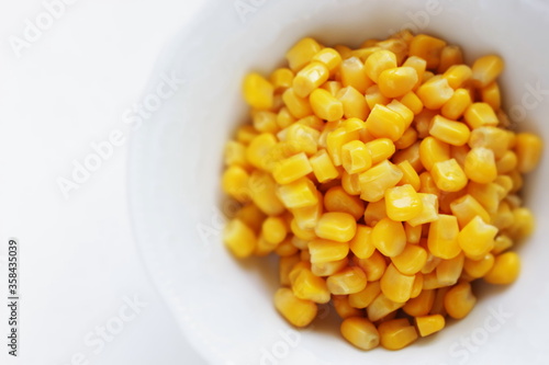 Prepared sweet corn on white background with copy space