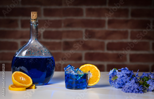 blue mojito cocktail with orange photo