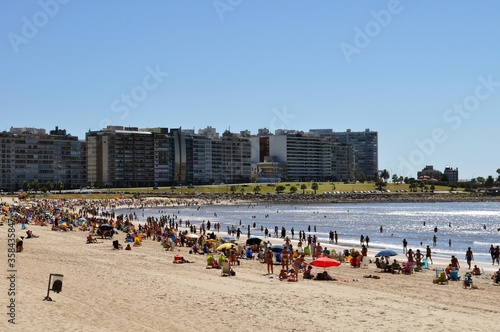 Cityscape urban scene at summer at pocitos beach in Montevideo Uruguay photo