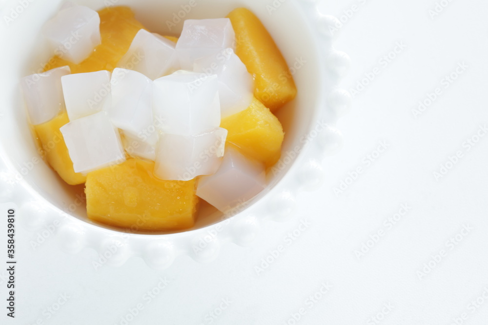 canned peach and Nata de coco in bowl for healthy dessert canned peach and Nata de coco in bowl for healthy dessert