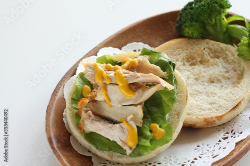 Chicken and mustard sauce in English muffin sandwich for comfort breakfast 
