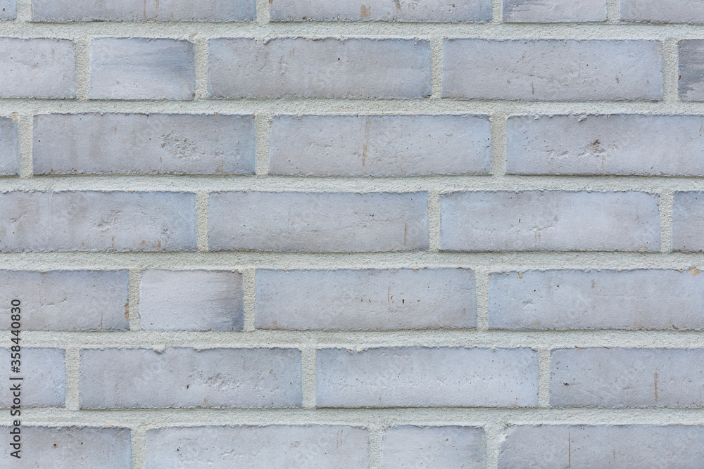 Obraz premium Graue Mauer aus Ziegelsteinen querformatg