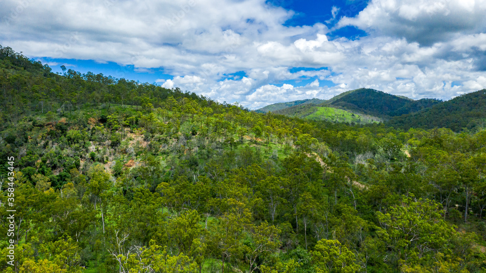 Kroombit Tops National Park summer landscape with fresh water creek and swimming hole and vibrant green vegetation, Queensland