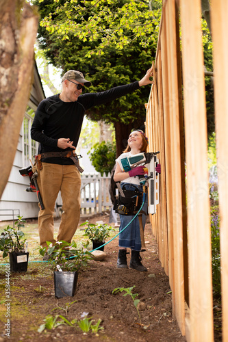 Father and daughter doing home improvement