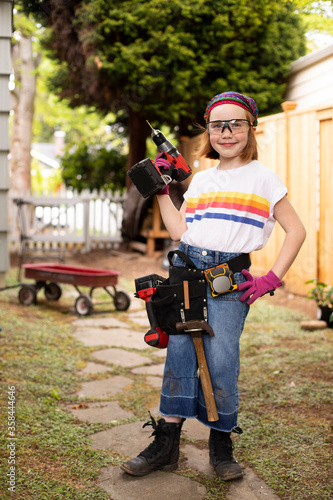Young girl with power tools