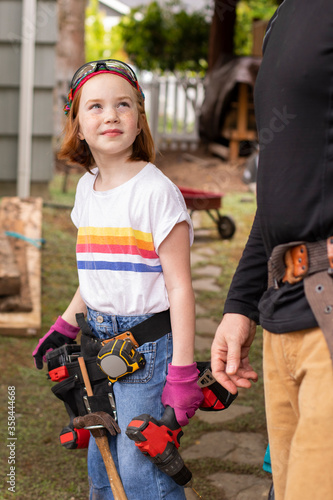 Girl and dad with power tools