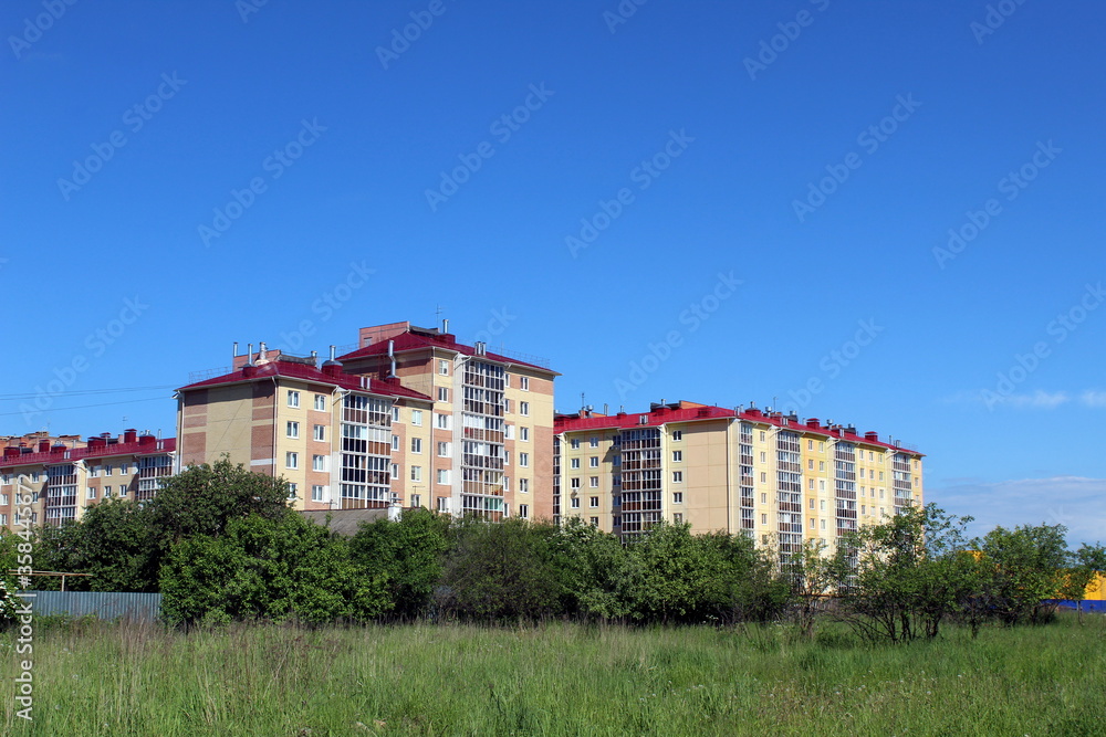 New built houses on the outskirts of the city on a summer day