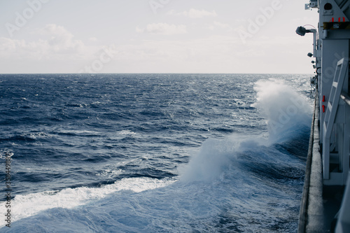 A cruise ship cuts through the waves in the Indian ocean.