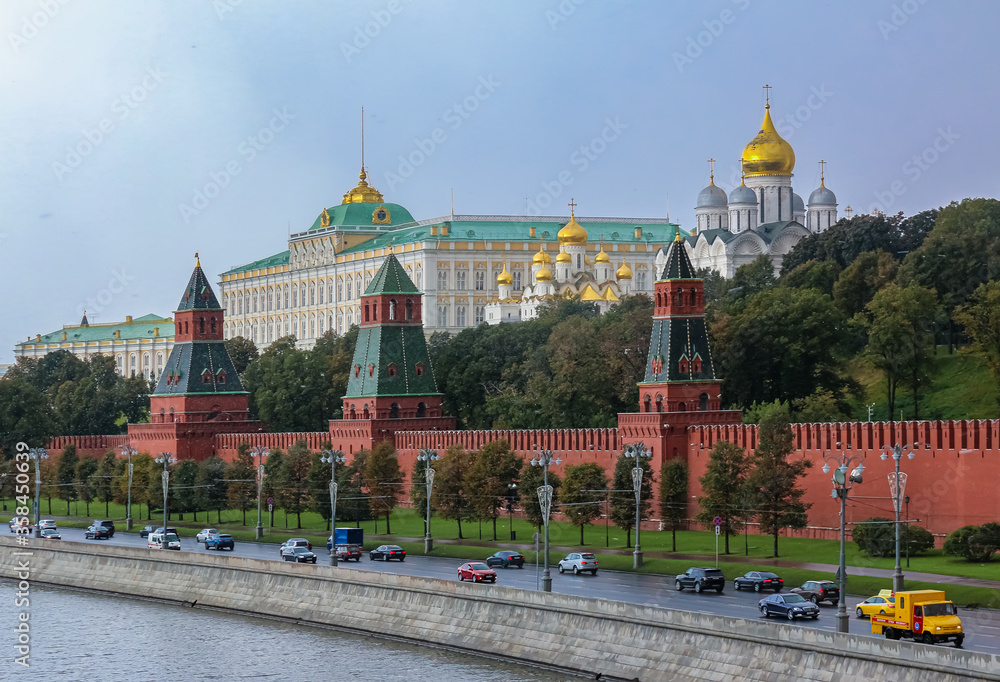 The Kremlin wall, tower and domes of cathedrals blurred in a winter snow storm with snowflakes in the air, Moscow Russia The Kremlin wall, tower and domes of cathedrals blurred in a winter snow storm with snowflakes in the air, Moscow Russia