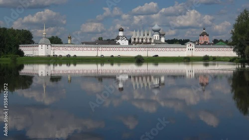 View of the Tikhvin assumption monastery from lake Tabora on a July day. Leningrad region, Russia  photo