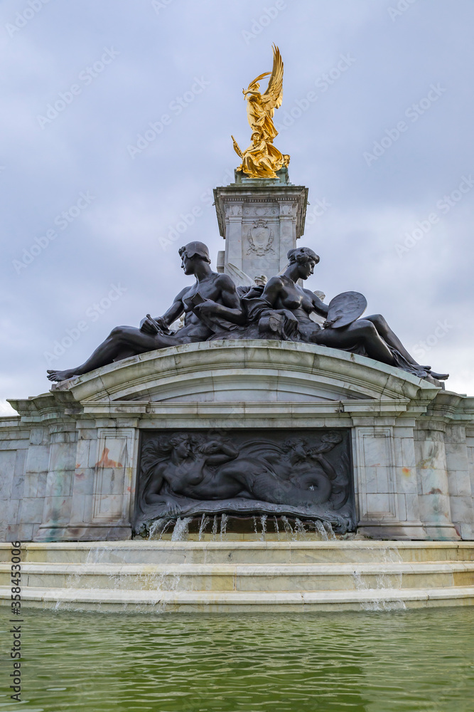 Victoria Memorial and fountain in front of the Buckingham Palace, royal residence of the British Monarchs in London UK