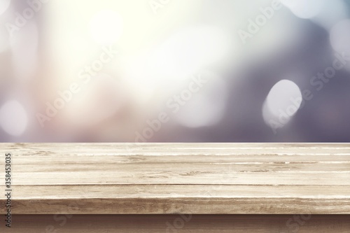 Wooden empty table top on blur background