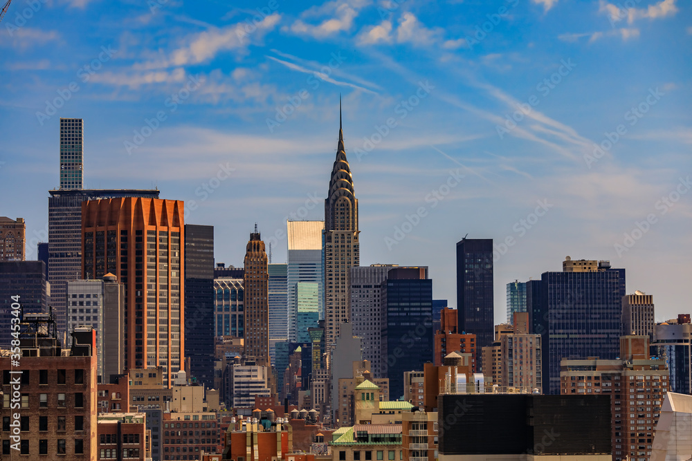 Fototapeta premium Aerial view of the the iconic skyline and skyscrapers in Midtown Manhattan, New York, USA
