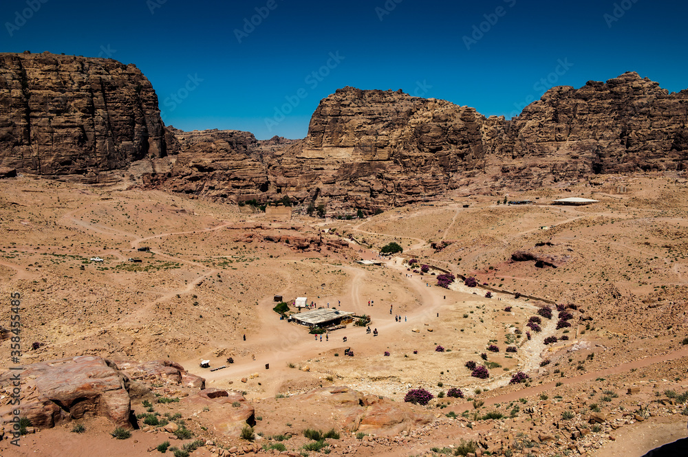 It's Canyon in Petra (Rose City), Jordan. The city of Petra was lost for over 1000 years. Now one of the Seven Wonders of the Word