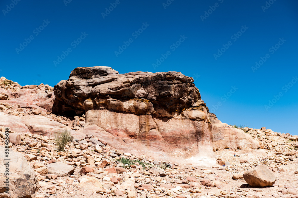 It's Rocks in Petra (Rose City), Jordan. The city of Petra was lost for over 1000 years. Now one of the Seven Wonders of the Word