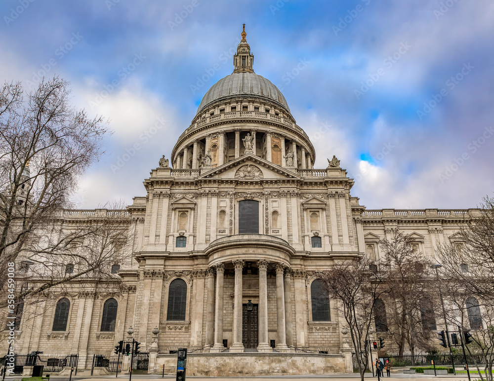 View of the famous St. Paul's Cathedral in city center on a cloudy day in London, England View of the famous St. Paul's Cathedral in city center on a cloudy day in London, England
