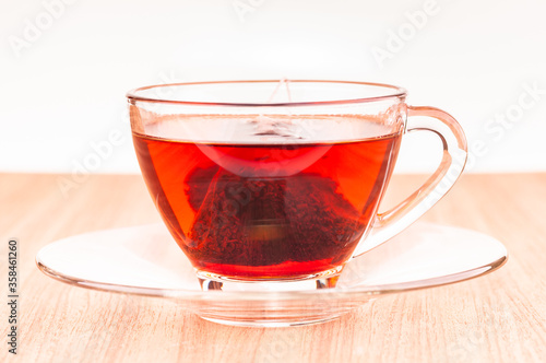 Pyramid mesh teabag in a glass cup