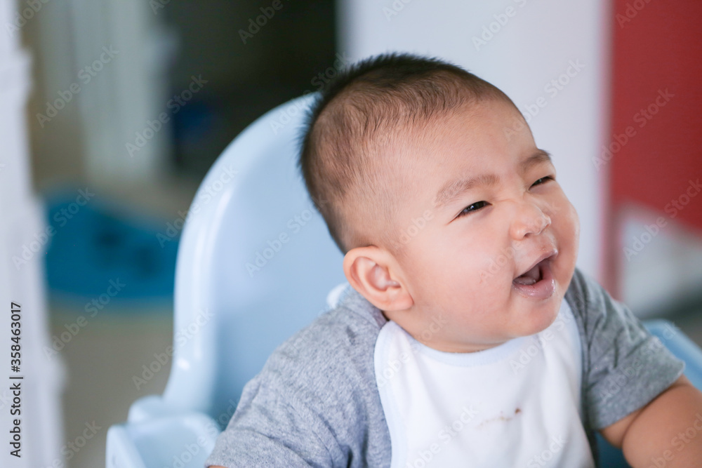 The baby is eating deliciously fed by the mother - Bright tone and focus point concept. The baby is eating deliciously fed by the mother - Bright tone and focus point concept.