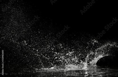 Fototapeta water splash on black background