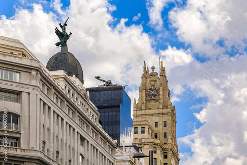 View of Edificio Telefonica and other buildings on Gran Via shopping street in the center of the city Madrid, Spain photo