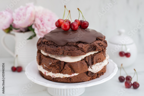 black forest chocolate cake with cherry pie filling with dark chocolate glaze