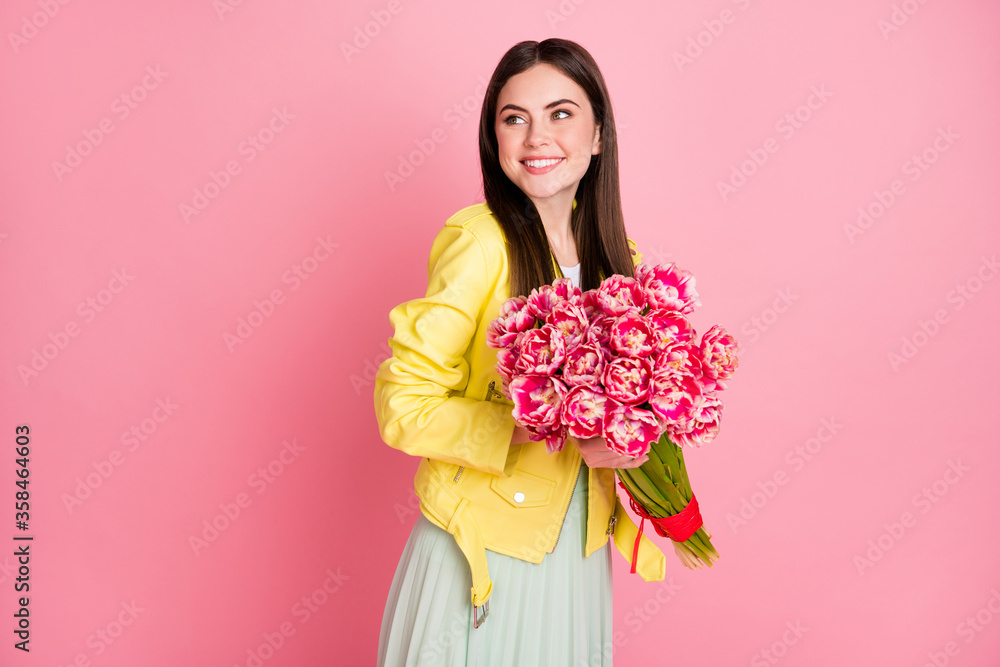 Portrait of her she nice-looking attractive lovely charming cheerful cheery girl holding in hands flowers gift from husband isolated on bright vivid shine vibrant yellow color background Portrait of her she nice-looking attractive lovely charming cheerful cheery girl holding in hands flowers gift from husband isolated on bright vivid shine vibrant yellow color background