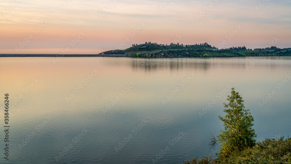 summer dawn over Horsetooth Reservoir at foothills of Rocky Mountains in northern Colorado, popular recreation destination in Fort Collins area summer dawn over Horsetooth Reservoir at foothills of Rocky Mountains in northern Colorado, popular recreation destination in Fort Collins area