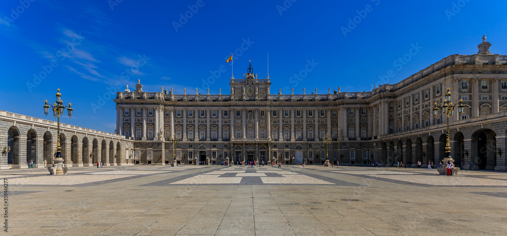 Panorama of the ornate baroque architecture of the Royal Palace or Palacio Real and Plaza de la Armeria in Madrid, Spain
