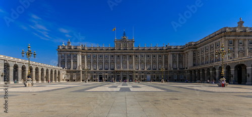 Panorama of the ornate baroque architecture of the Royal Palace or Palacio Real and Plaza de la Armeria in Madrid, Spain