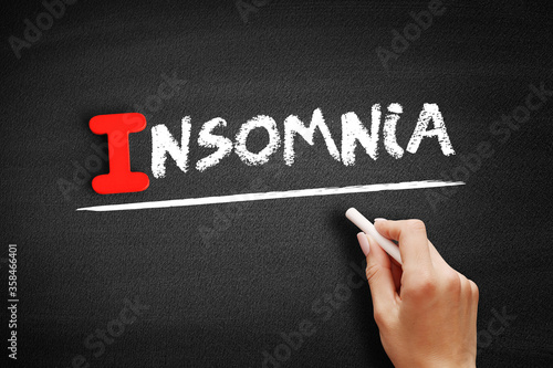 Insomnia text on blackboard, medical concept background