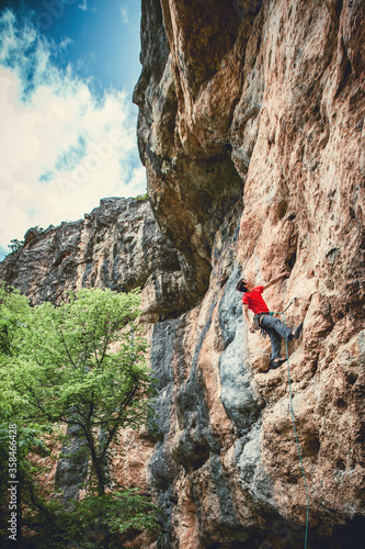 Man climbing a rock.