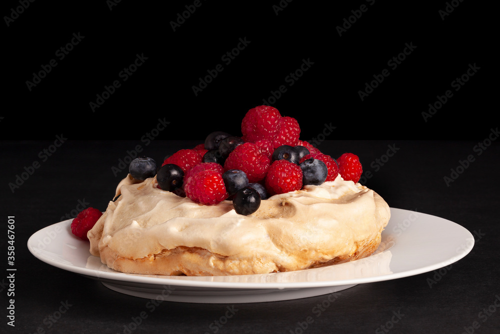 Meringue dessert Pavlova with fresh blackberries and raspberries. Meringue dessert Pavlova with fresh blackberries and raspberries.
