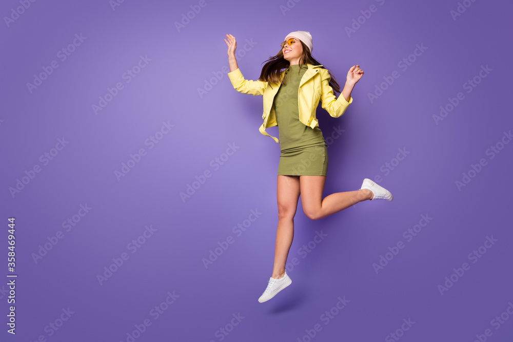 Full length body size view of her she nice attractive pretty dreamy cheerful girl jumping walking enjoying free time isolated over bright vivid shine vibrant lilac purple violet color background