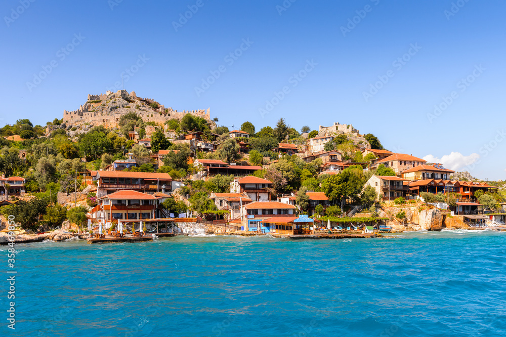 It's Kalekoy village (Simena) with the Byzantine castle in the c It's Kalekoy village (Simena) with the Byzantine castle in the c