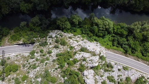 Aerial view of empty road and tunnel in the mountain and dark falling on the sky 