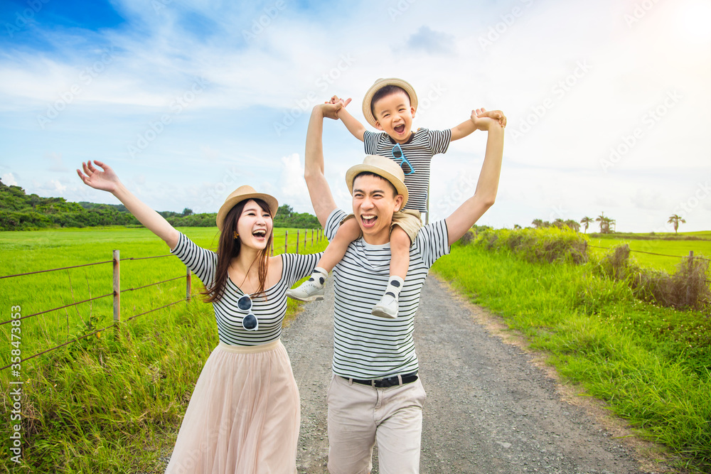 happy family having fun and walking on the country road happy family having fun and walking on the country road