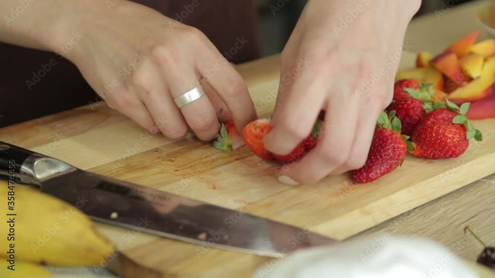 Hands woman cuts a pear on a wooden board vegetarian ingredient cook ripe fruit board cooking food fresh healthy Hands woman cuts a pear on a wooden board vegetarian ingredient cook ripe fruit board cooking food fresh healthy